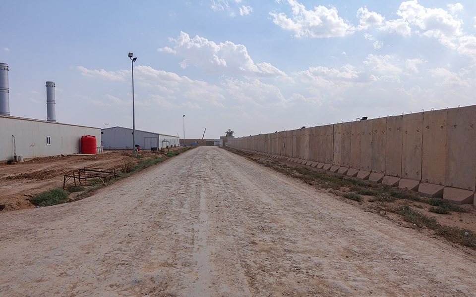 The surrounding wall securing the construction site in Iraq