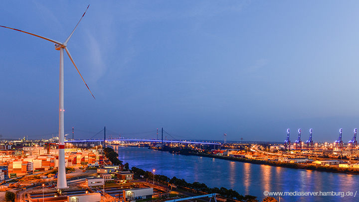 Container-Port-in-Hamburgs-harbor-with-wind-turbine-by-night- Container-Port-in-Hamburgs-harbor-with-wind-turbine-by-night-