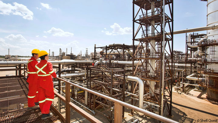 Two workers on a catwalk at Shell Quest CCS facility Two workers on a catwalk at Shell Quest CCS facility