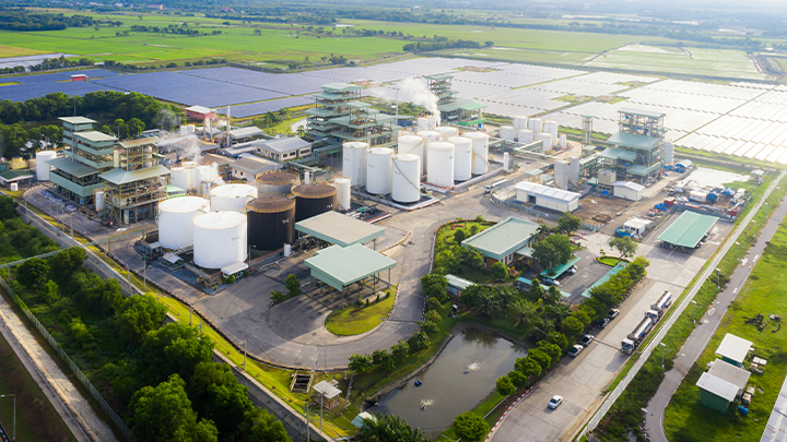 Aerial perspective of a factory and solar panels