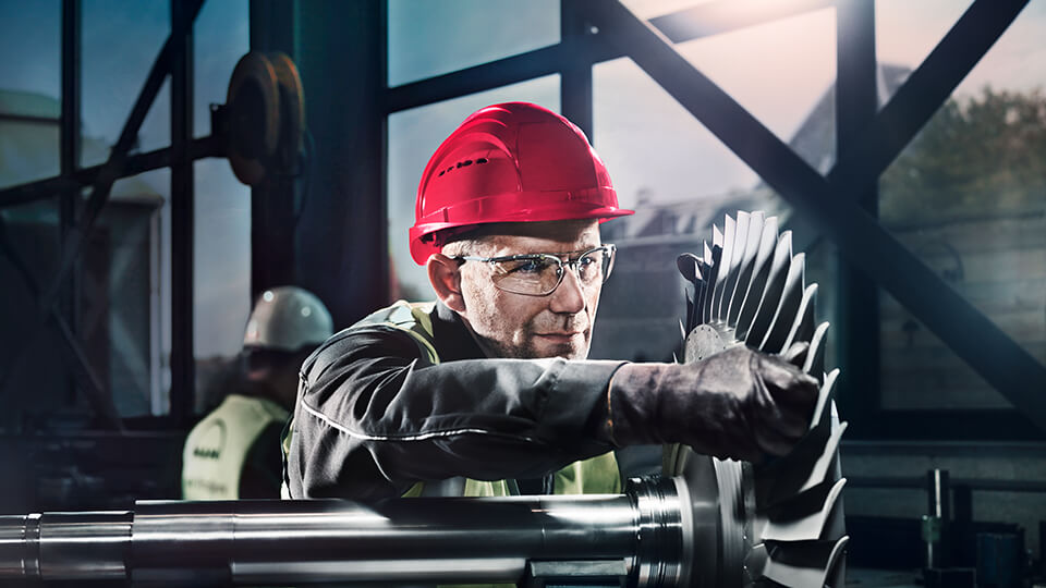 MAN with red helmet working on product