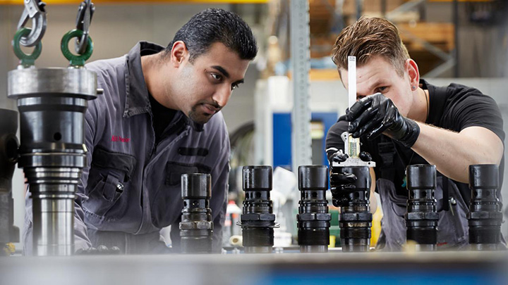 Service engineers working on a marine enginge